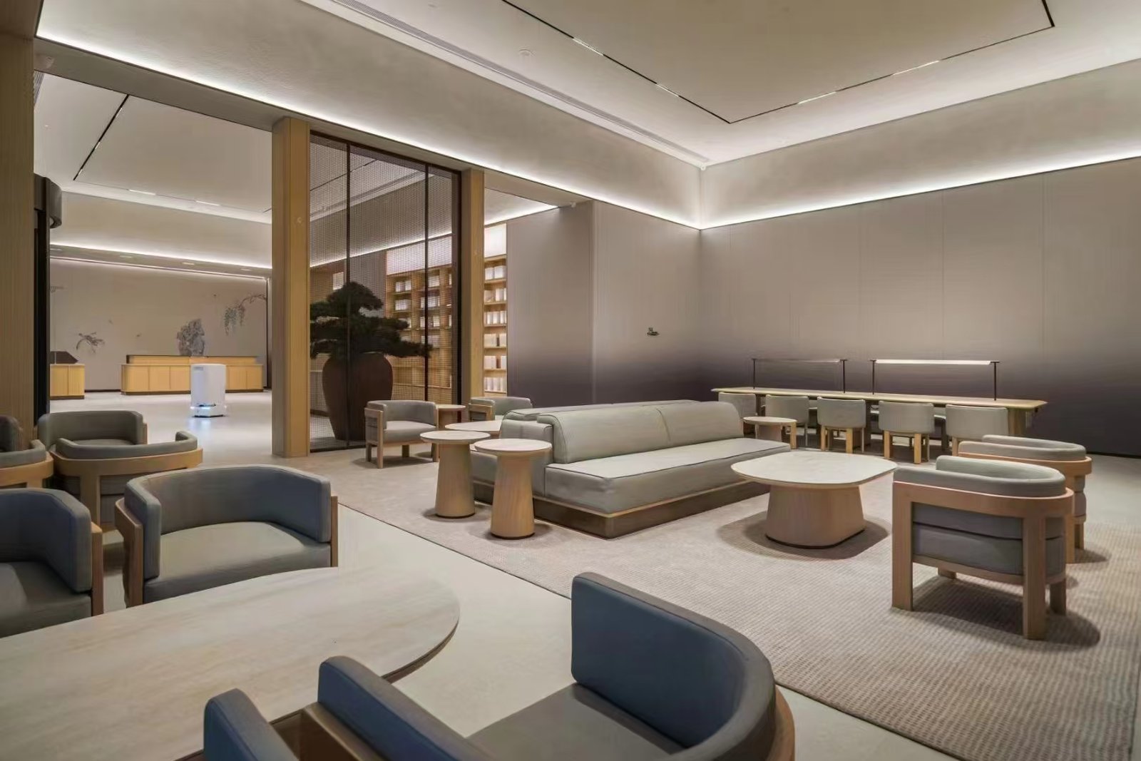 Upholstered hotel lobby benches arranged in a contemporary hotel waiting area