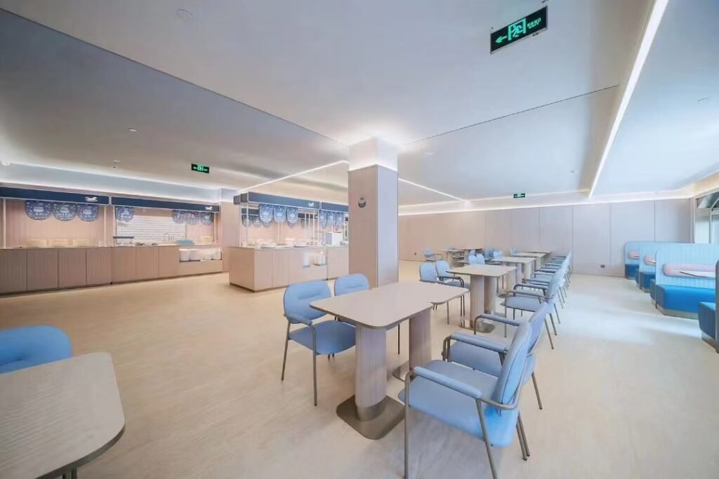 Upholstered restaurant dining chairs arranged around tables in a commercial dining area