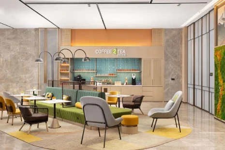 Hotel lobby furniture with lounge chairs and tables for hospitality projects