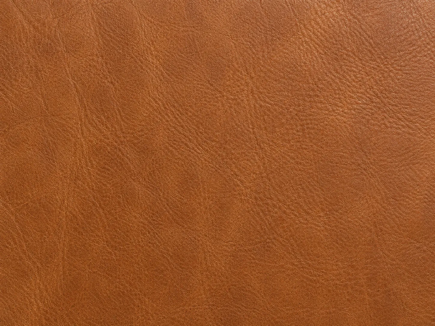 Cognac brown leather-style surface with natural grain texture